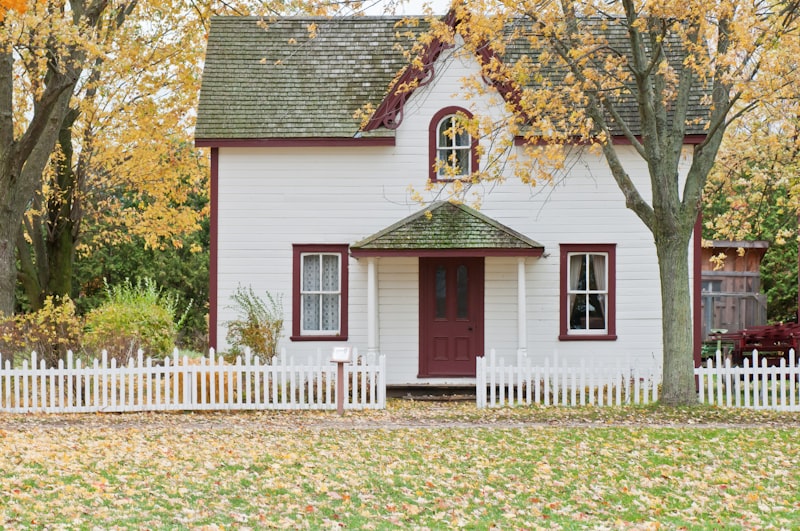Cottage with a restored front lawn and mature trees