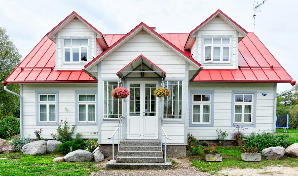 Farmhouse with a broad manicured lawn